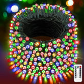 Multicolored string lights with a remote control on a dark background